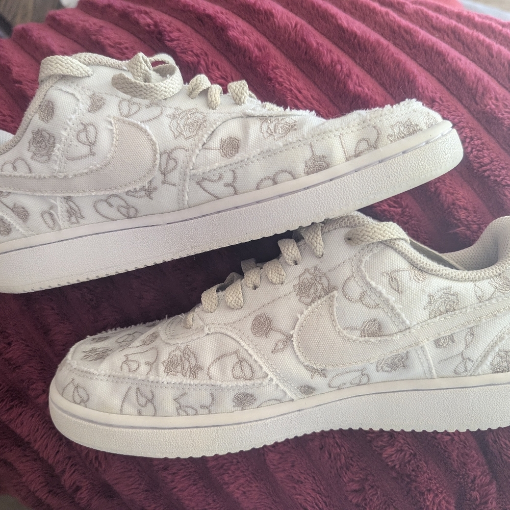 Nike White and Cream Sneakers with Classic Low-Top Design and All-Over Print